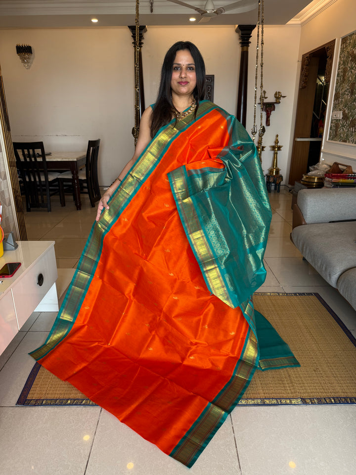 Fanta Orange with Turquoise Blue Traditional Borders ,Zari Rich Butta in the Body and Grand PalluKorvai Silk Cotton Saree