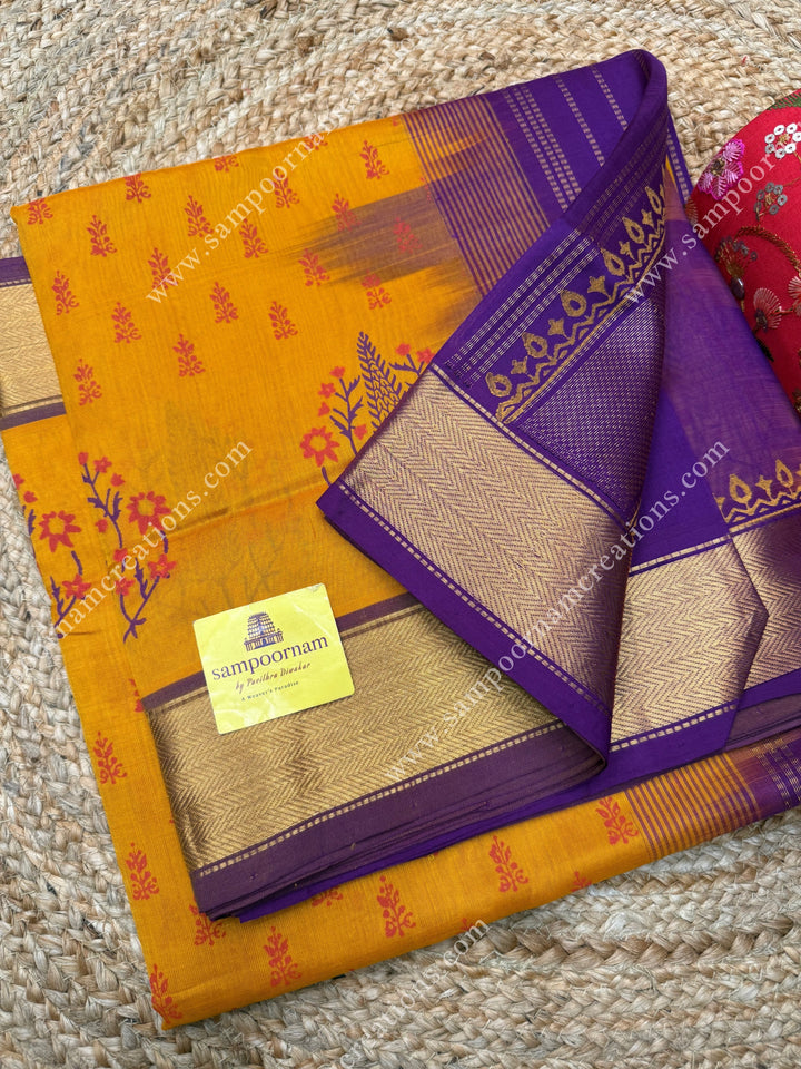 Manjal with Magenta  , Floral Print in the body  and Rich Pallu Handblock Printed Silk Cotton Saree