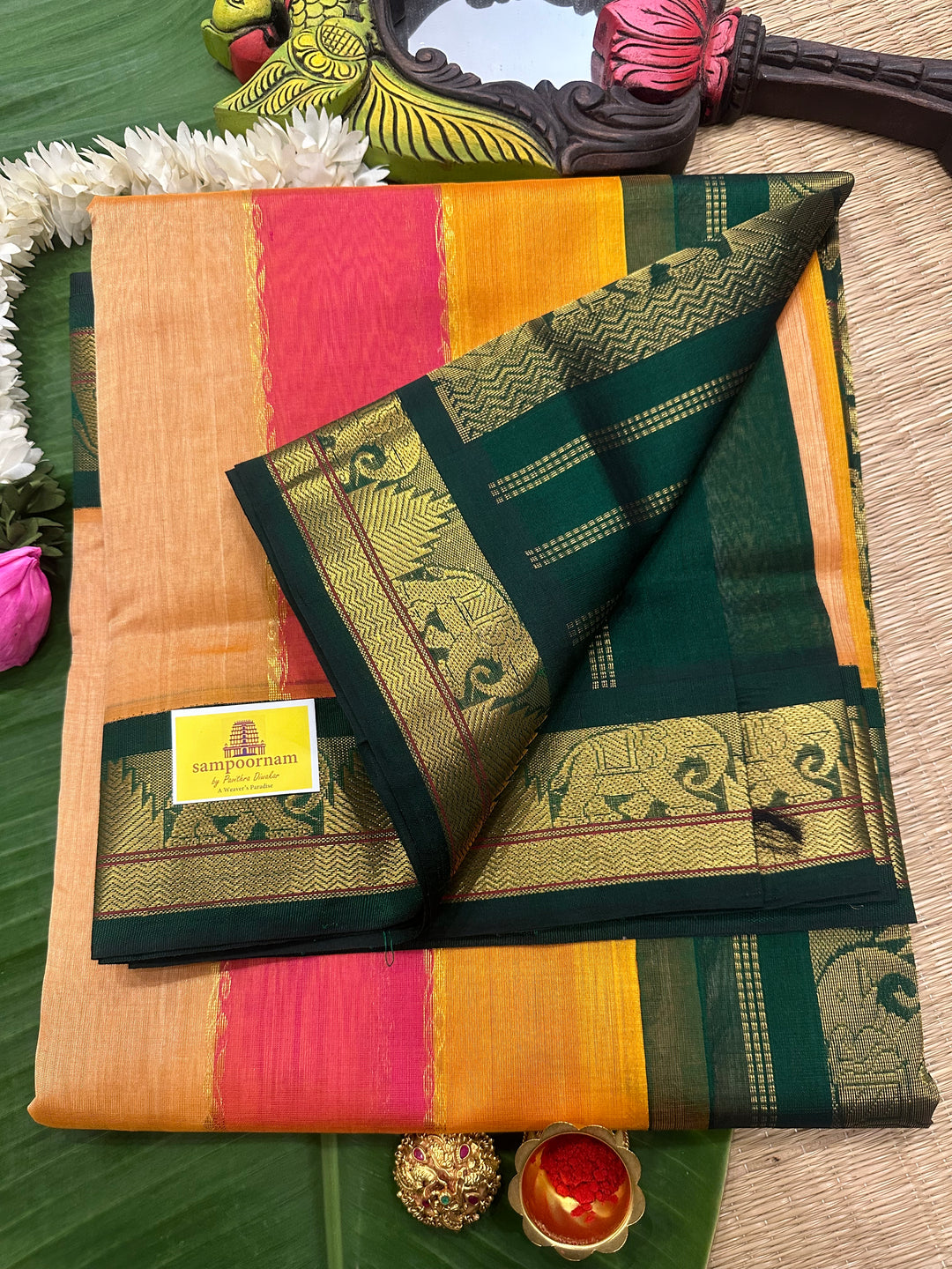 A fusion of Colours Pink , Biscuit and Orange with Green Border and Pallu Korvai Silk Cotton Saree