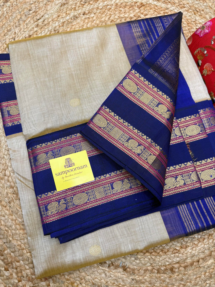 Light Gold with Blue , Rich Zari butta in the body , Rettapet borders and rich Pallu Korvai Silk Cotton Saree