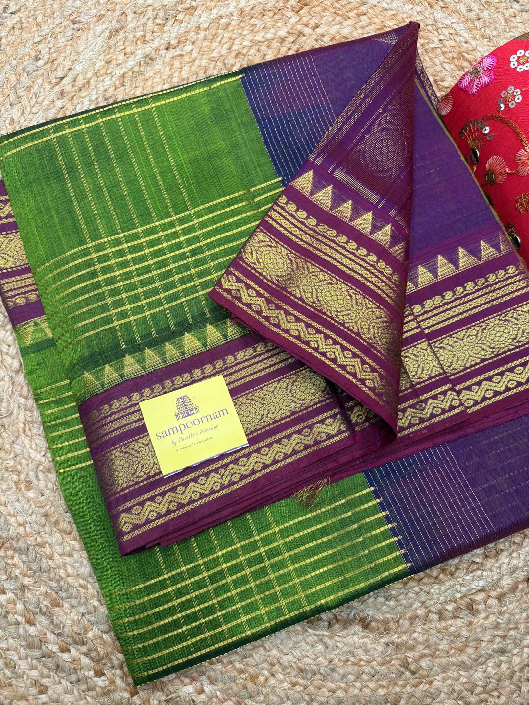 Green with Dark Magenta , Zari Checks in the body , Traditional borders and Rich Pallu Korvai Silk Cotton Saree