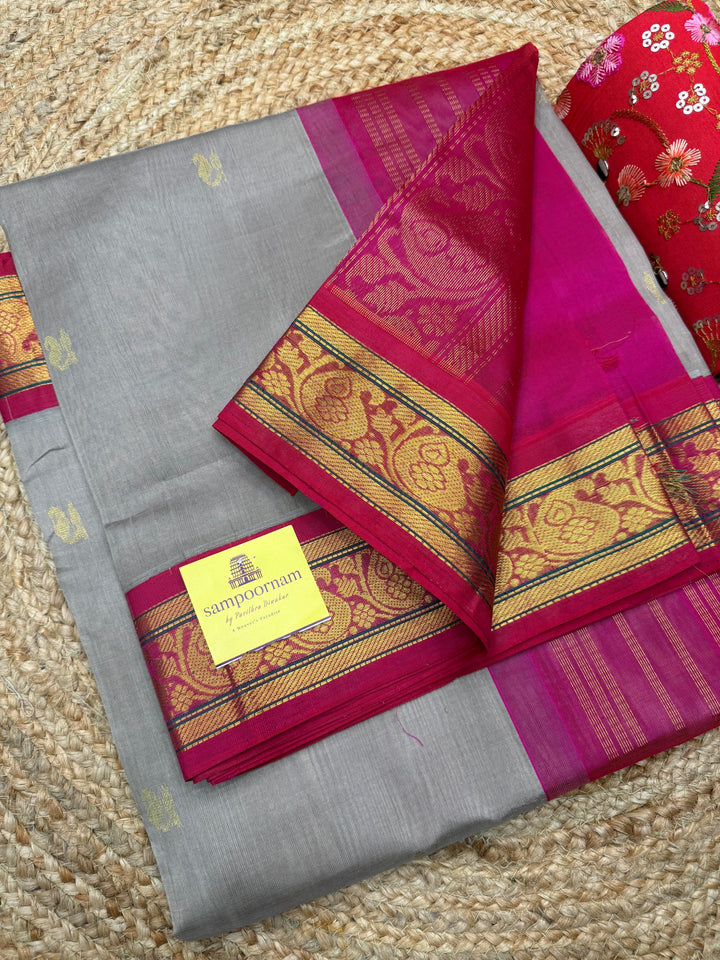 Grey with Magenta , Rich Zari Mango butta in the body , Traditional  borders and rich Pallu Korvai Silk Cotton Saree