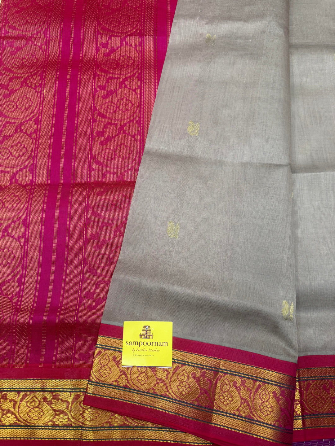 Grey with Magenta , Rich Zari Mango butta in the body , Traditional  borders and rich Pallu Korvai Silk Cotton Saree