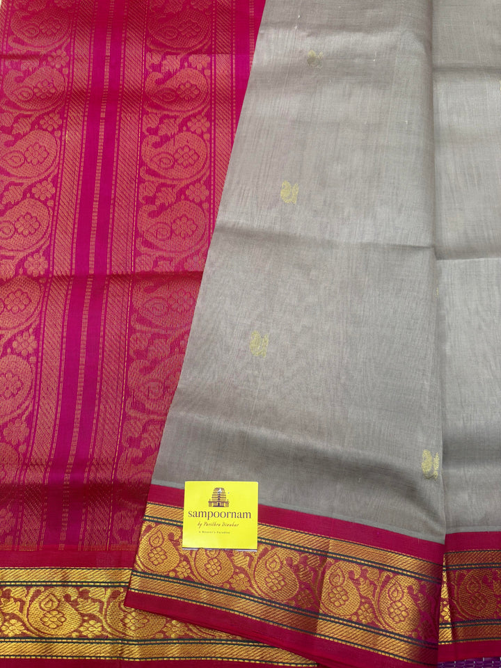 Grey with Magenta , Rich Zari Mango butta in the body , Traditional  borders and rich Pallu Korvai Silk Cotton Saree