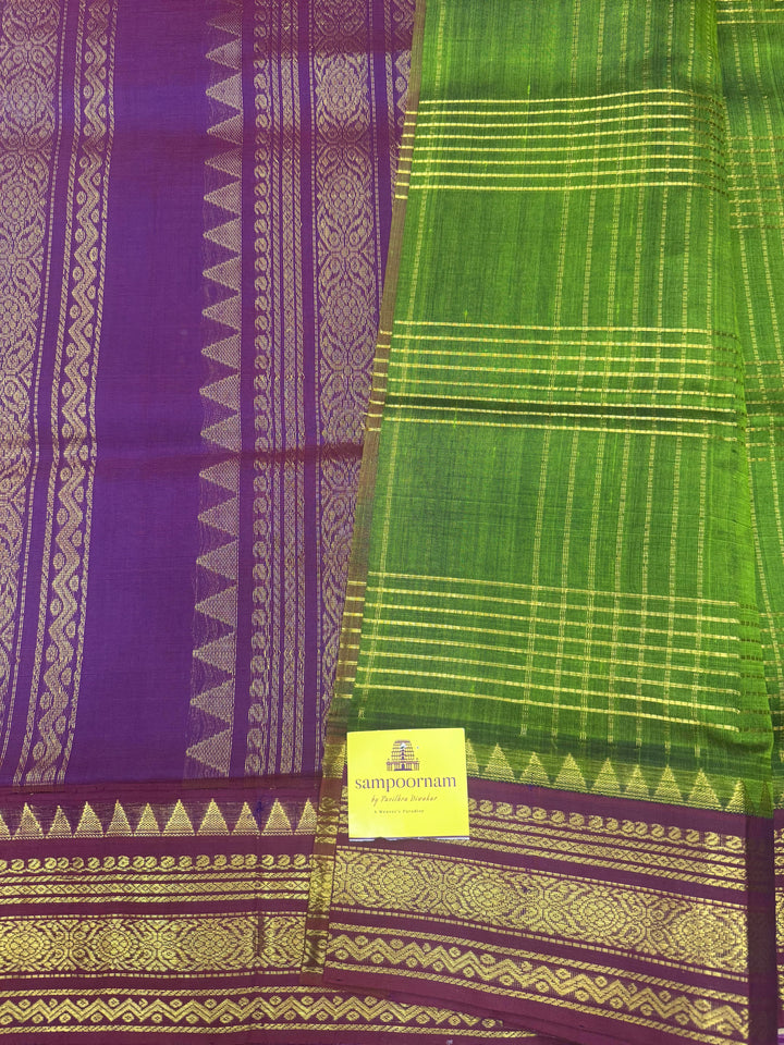 Green with Dark Magenta , Zari Checks in the body , Traditional borders and Rich Pallu Korvai Silk Cotton Saree