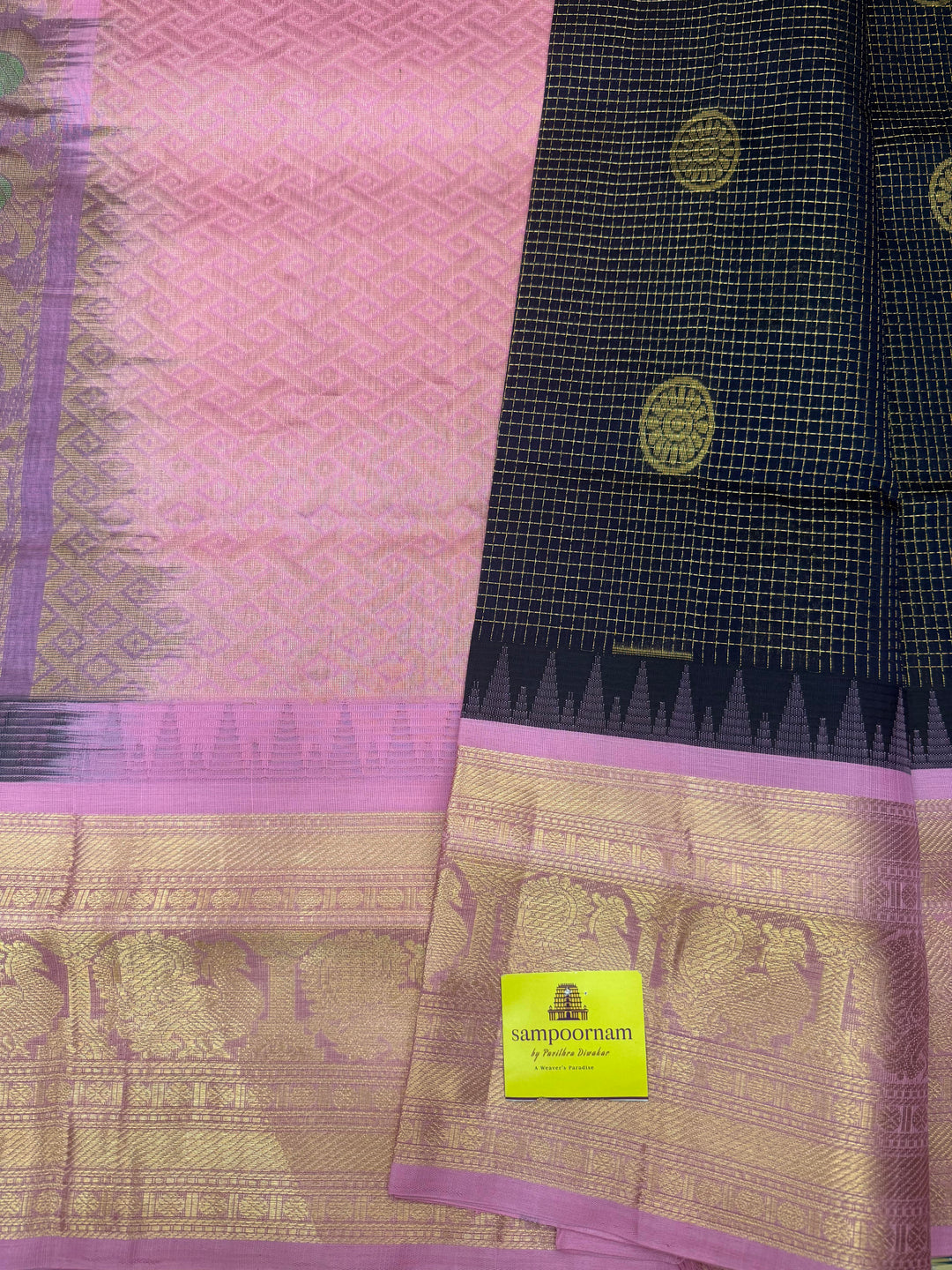 Dark Blue with Baby Pink , Rich Zari checks with Chakkram butta in the body , Traditional One side big border and rich Pallu Korvai Silk Cotton Saree