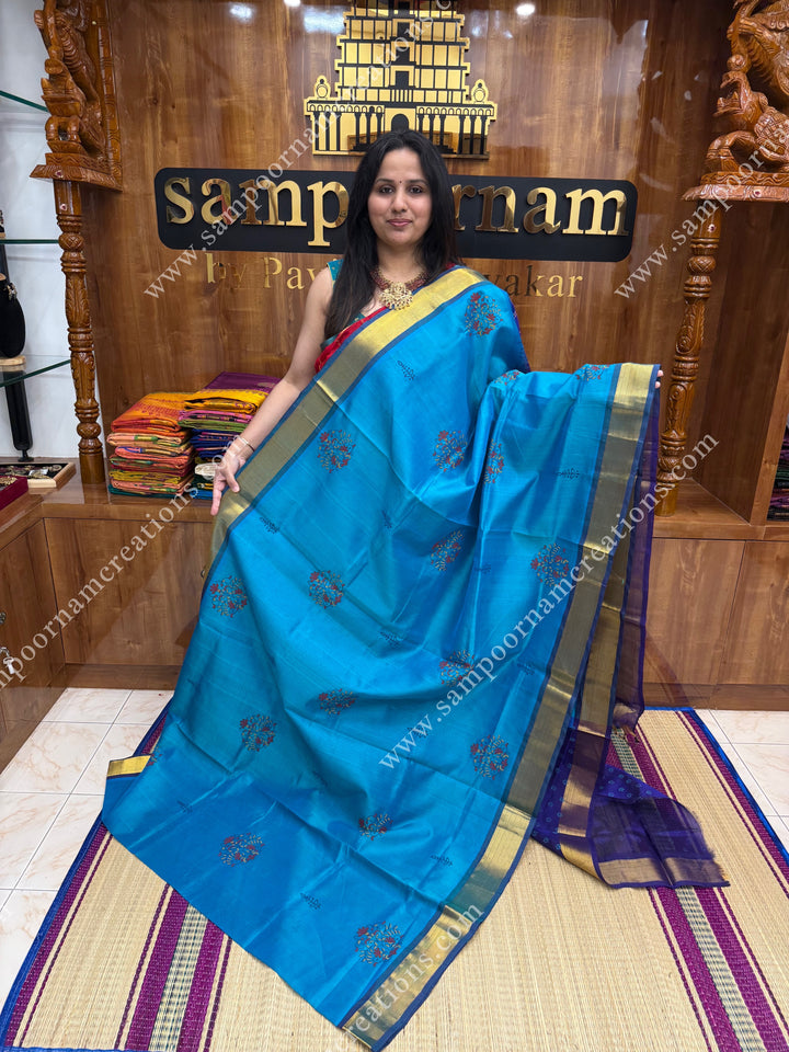 Blueish Green with Dark Blue  , Floral Print in the body  and Rich Pallu Handblock Printed Silk Cotton Saree