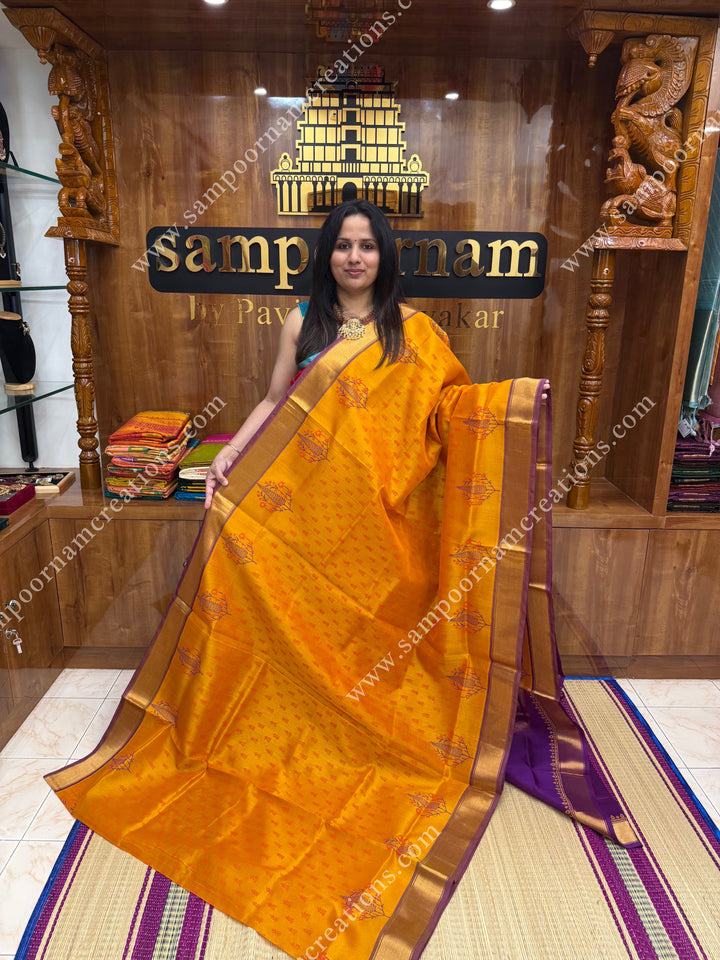 Manjal with Magenta  , Floral Print in the body  and Rich Pallu Handblock Printed Silk Cotton Saree