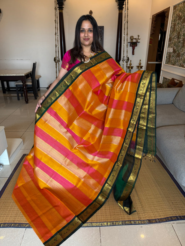 A fusion of Colours Pink , Biscuit and Orange with Green Border and Pallu Korvai Silk Cotton Saree