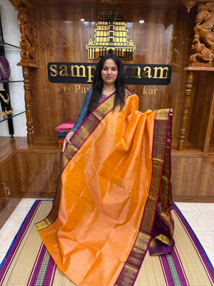Peach Pink with Purple , Rich Annam and Chakkram Zari butta in the body and Traditional Silk borders , rich Pallu, Korvai Silk Cotton Saree