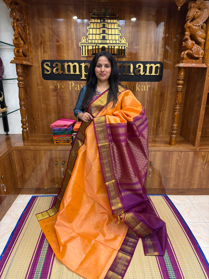 Peach Pink with Purple , Rich Annam and Chakkram Zari butta in the body and Traditional Silk borders , rich Pallu, Korvai Silk Cotton Saree