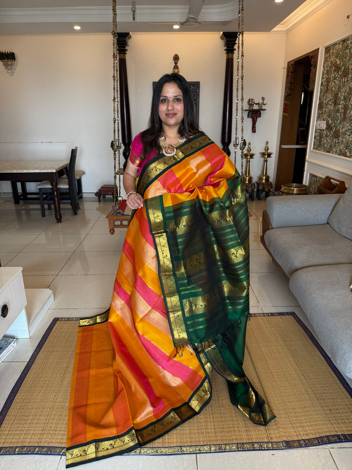 A fusion of Colours Pink , Biscuit and Orange with Green Border and Pallu Korvai Silk Cotton Saree
