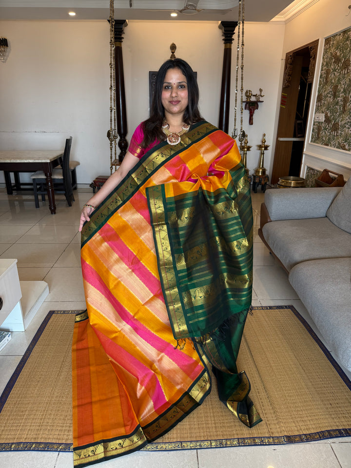 A fusion of Colours Pink , Biscuit and Orange with Green Border and Pallu Korvai Silk Cotton Saree