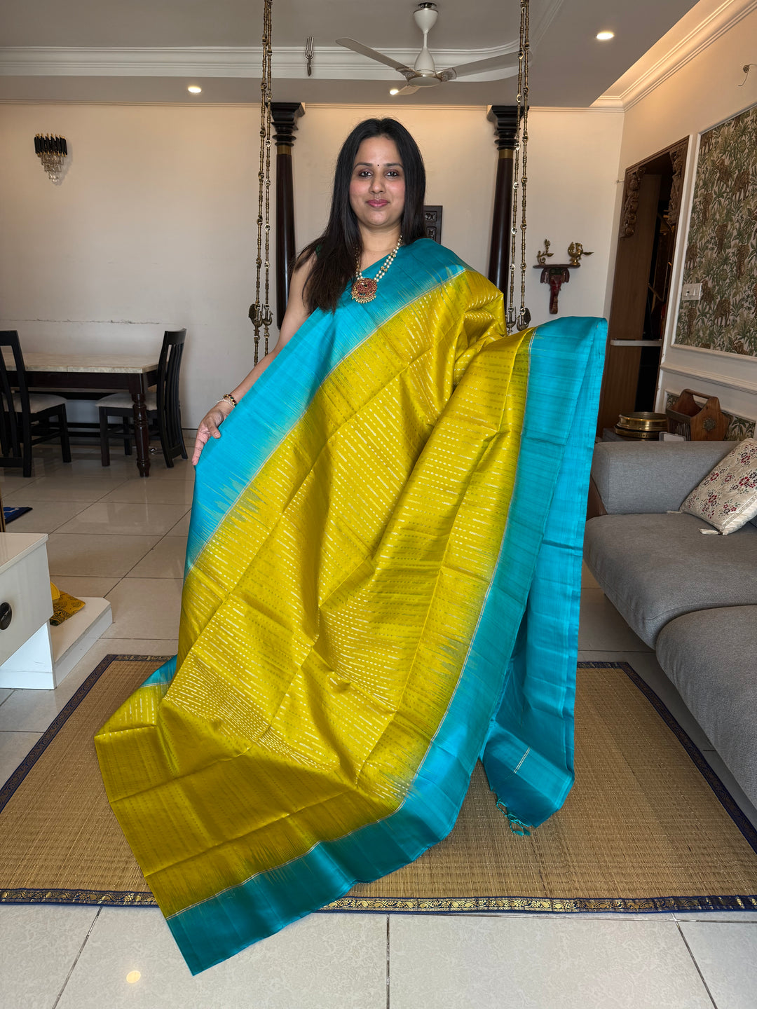 Lemon Yellow with Turquoise Blue rich Zari butta in silver and gold zari in the body , plain border and rich Pallu , pure soft silk saree