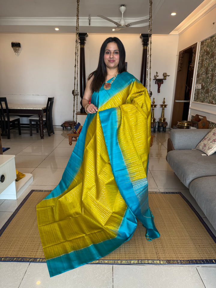 Lemon Yellow with Turquoise Blue rich Zari butta in silver and gold zari in the body , plain border and rich Pallu , pure soft silk saree