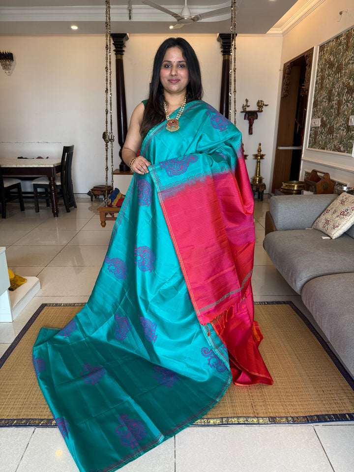 Light Blue with Orangish Pink , annam Handblock print in the body , simple zari lines in the Pallu and Blouse, pure soft silk saree
