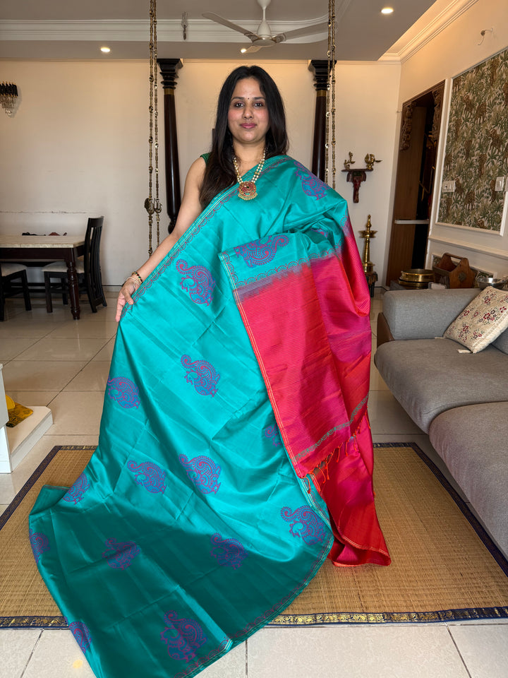 Light Blue with Orangish Pink , annam Handblock print in the body , simple zari lines in the Pallu and Blouse, pure soft silk saree