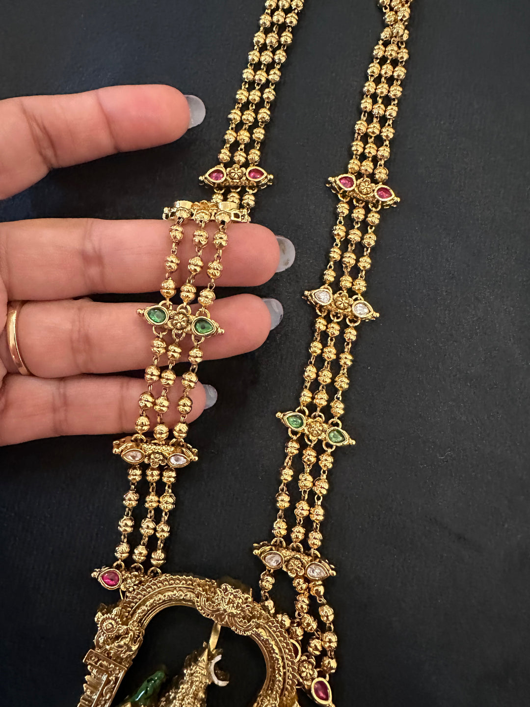 A classic three layer beaded neck piece with gold balls , red , green and white kemp stones , with Goddess Kamakshi Amman 3D Pendant .