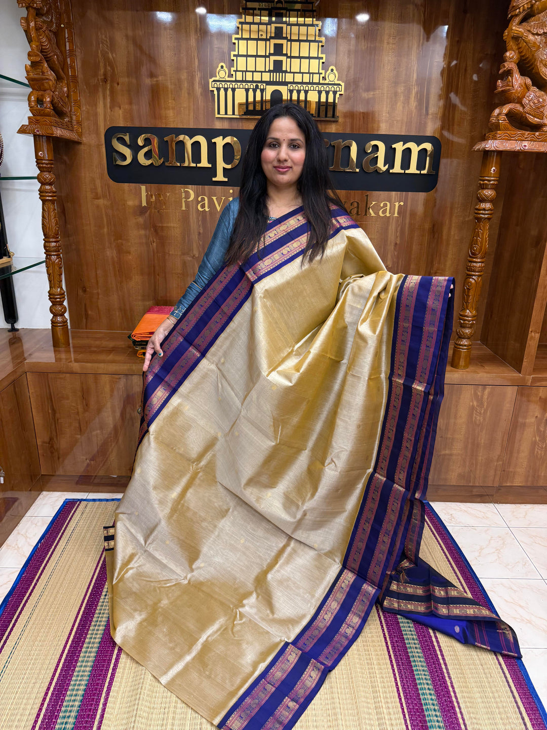 Light Gold with Blue , Rich Zari butta in the body , Rettapet borders and rich Pallu Korvai Silk Cotton Saree