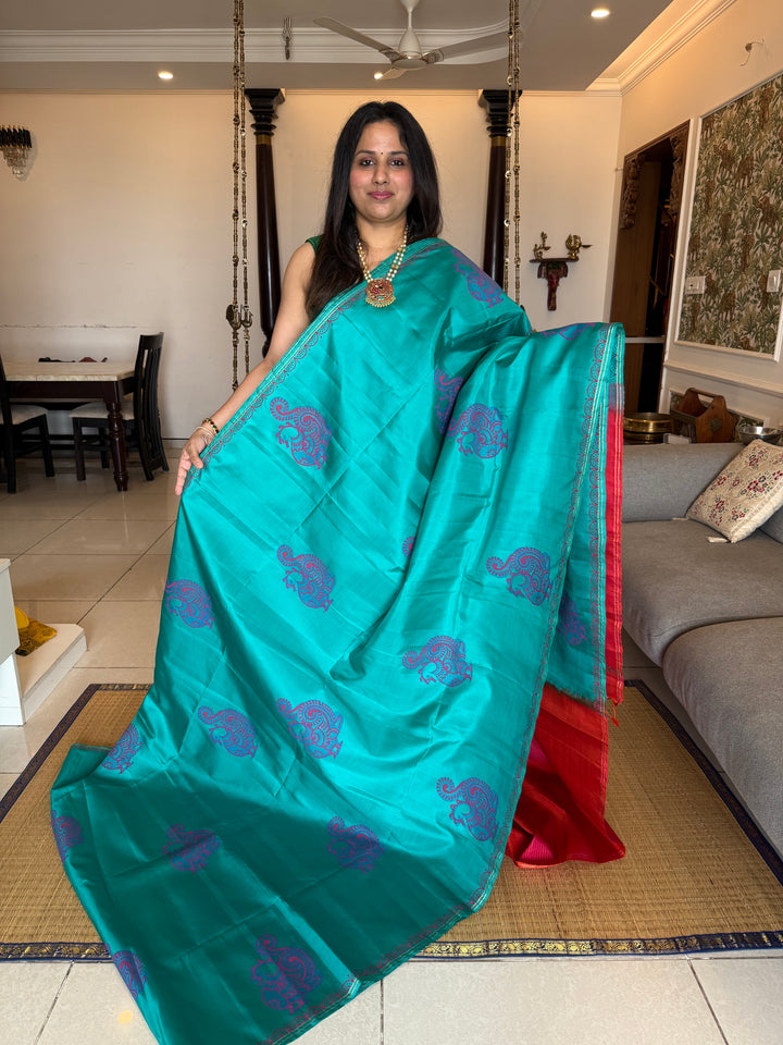 Light Blue with Orangish Pink , annam Handblock print in the body , simple zari lines in the Pallu and Blouse, pure soft silk saree