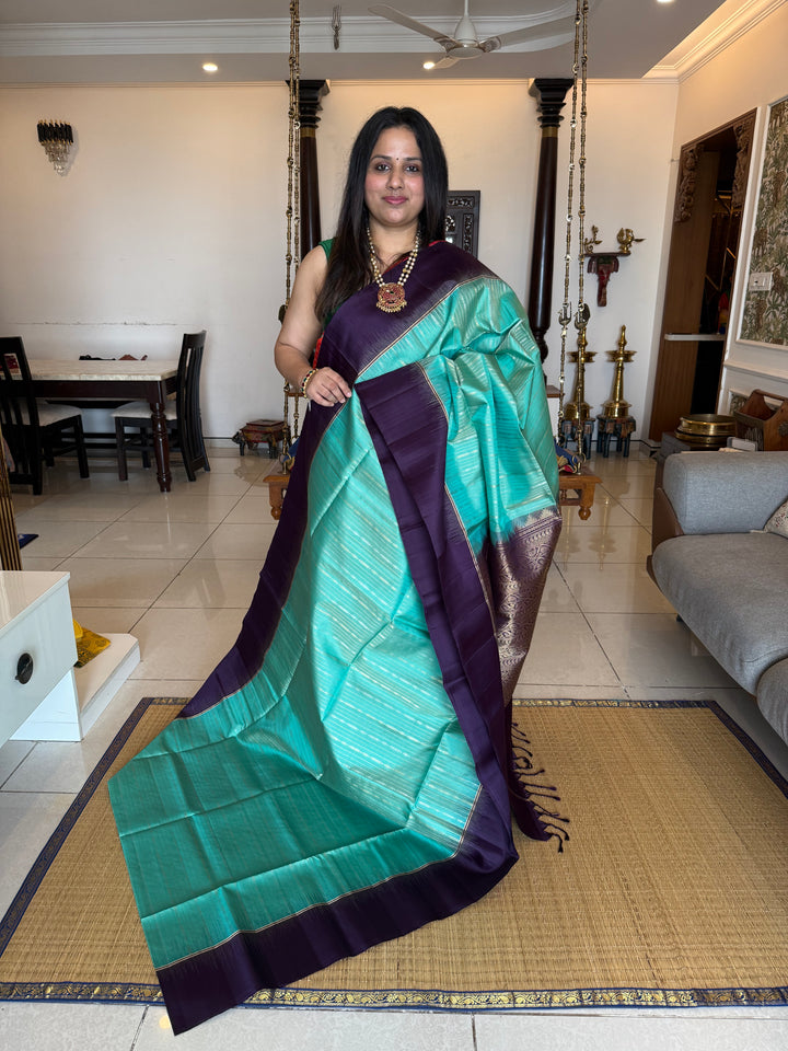 Pastel Light Blue with Purple , rich zari gold and silver zari butta in the body and grand  Pallu , pure soft silk saree