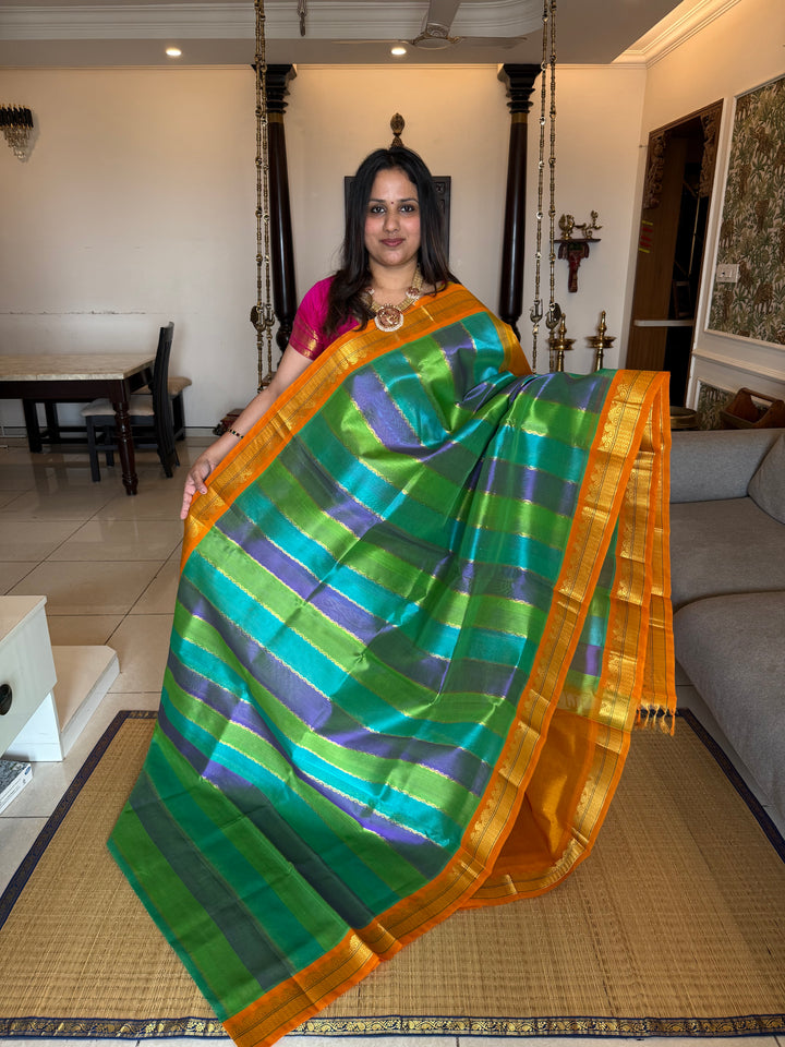 A fusion of Colours Turquoise Blue, Purple and Green with Fenugreek Colour ,Rich= Border and Pallu Korvai Silk Cotton Saree