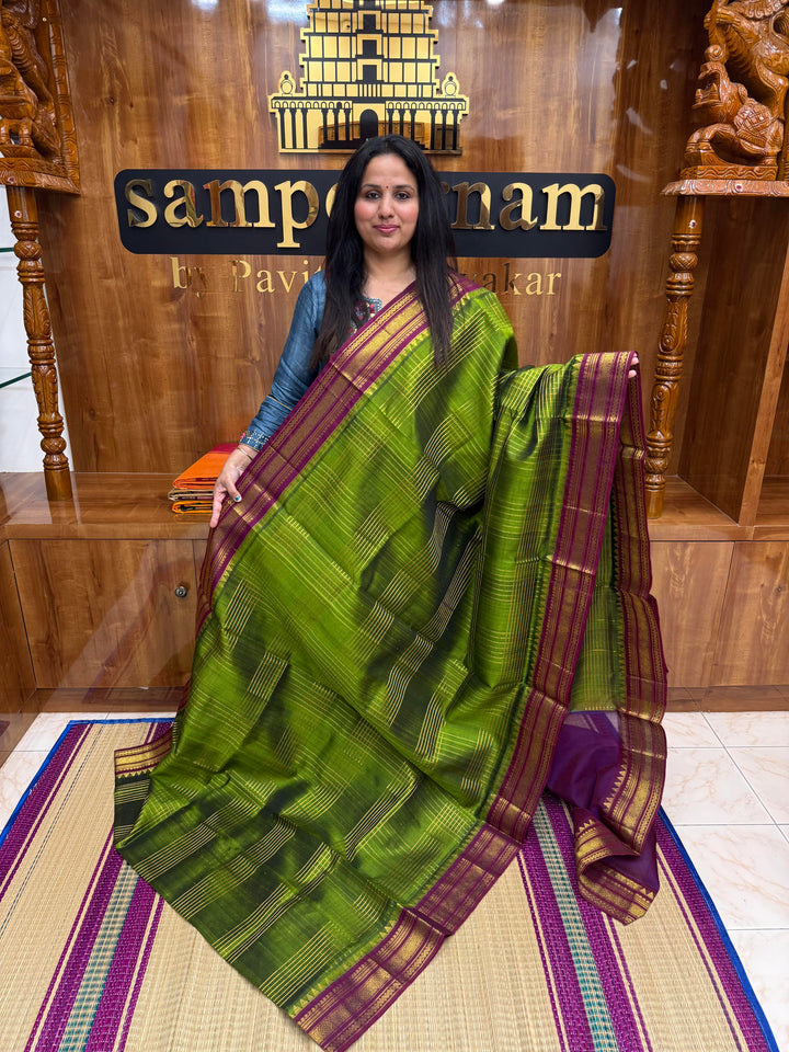 Green with Dark Magenta , Zari Checks in the body , Traditional borders and Rich Pallu Korvai Silk Cotton Saree
