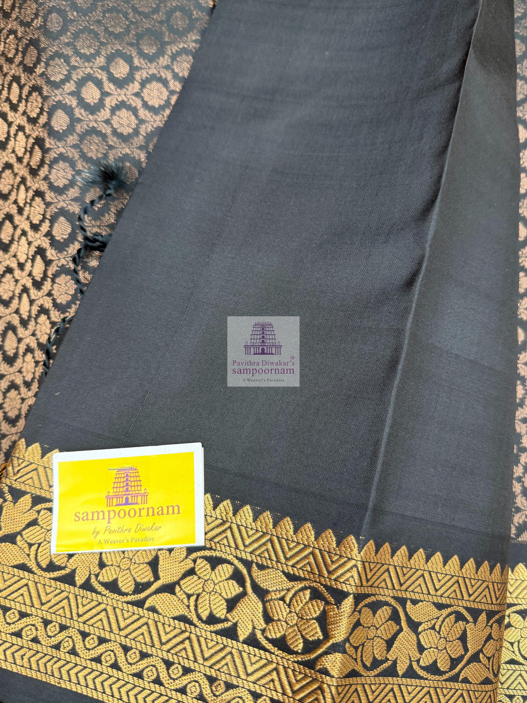 Black colour with Floral Banarasi rich Zari butta and Grand Gold Zari border Pure Soft Silk Saree