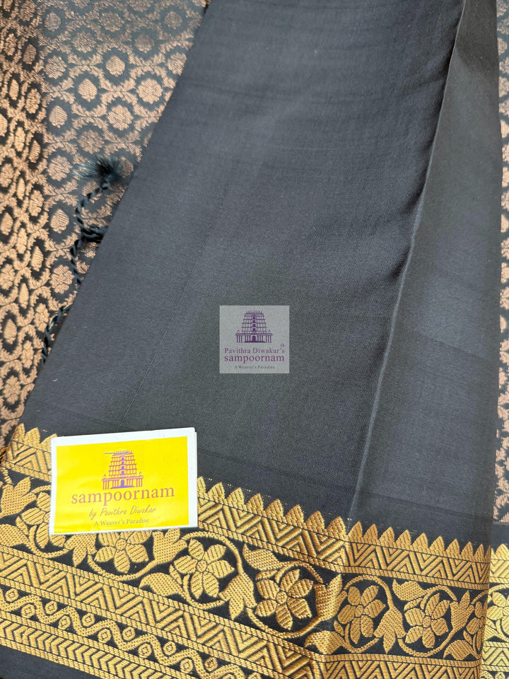 Black colour with Floral Banarasi rich Zari butta and Grand Gold Zari border Pure Soft Silk Saree