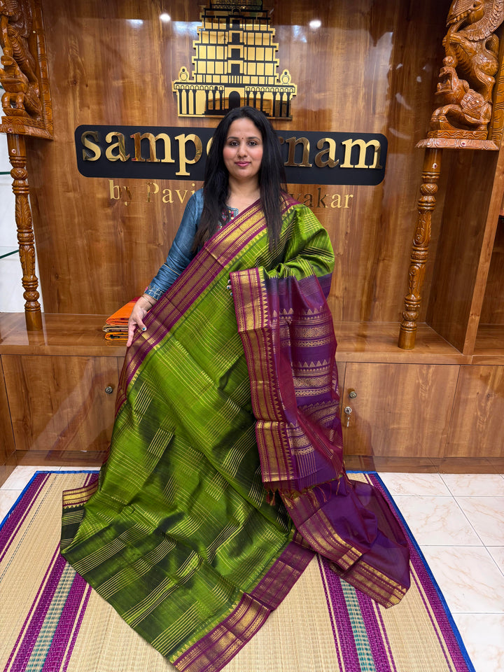 Green with Dark Magenta , Zari Checks in the body , Traditional borders and Rich Pallu Korvai Silk Cotton Saree