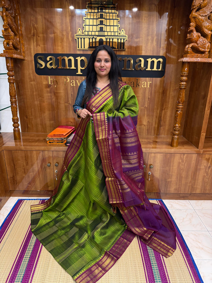 Green with Dark Magenta , Zari Checks in the body , Traditional borders and Rich Pallu Korvai Silk Cotton Saree
