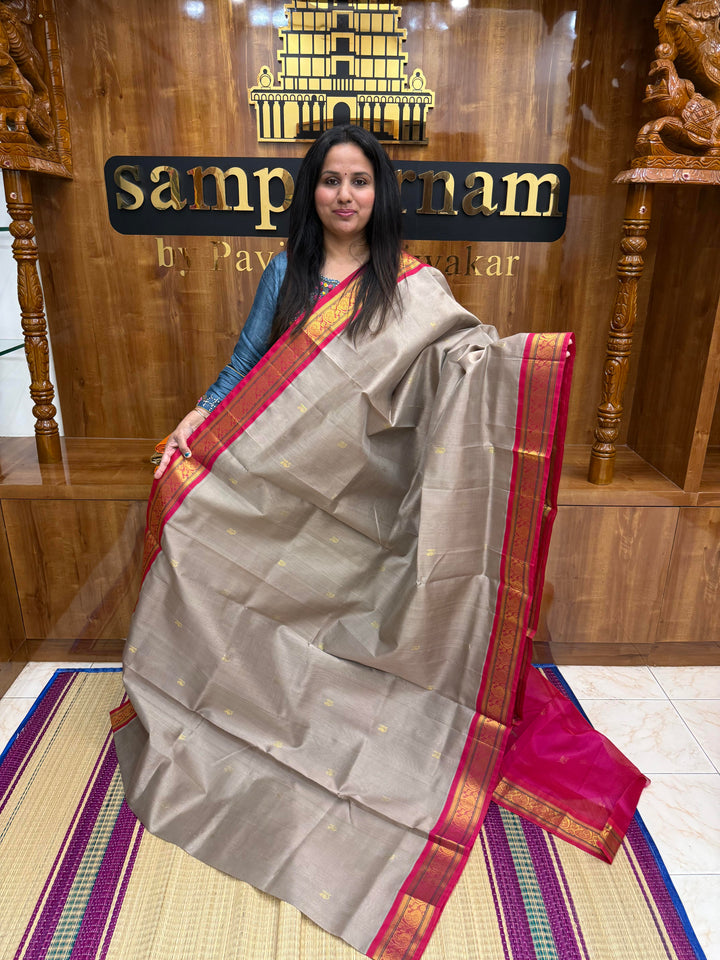 Grey with Magenta , Rich Zari Mango butta in the body , Traditional  borders and rich Pallu Korvai Silk Cotton Saree