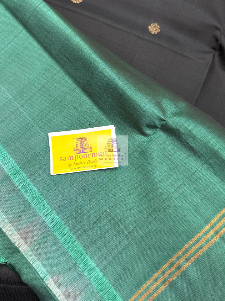 Black with Sage Green , Vairaoosi lines in the border , Floral Zari butta in the body and grand  Pallu Pure Soft Silk Saree