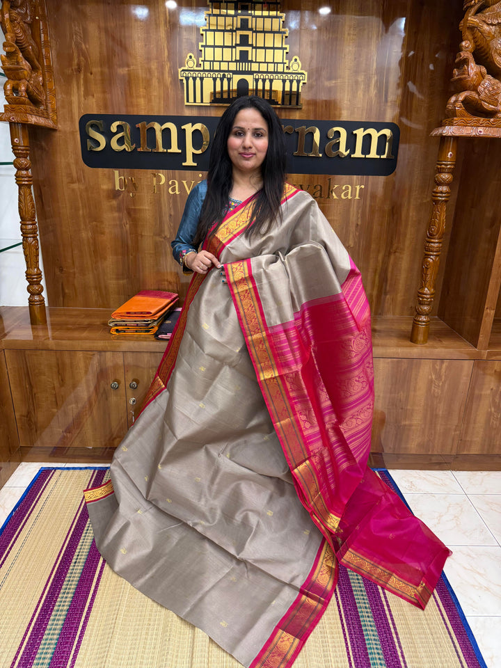 Grey with Magenta , Rich Zari Mango butta in the body , Traditional  borders and rich Pallu Korvai Silk Cotton Saree