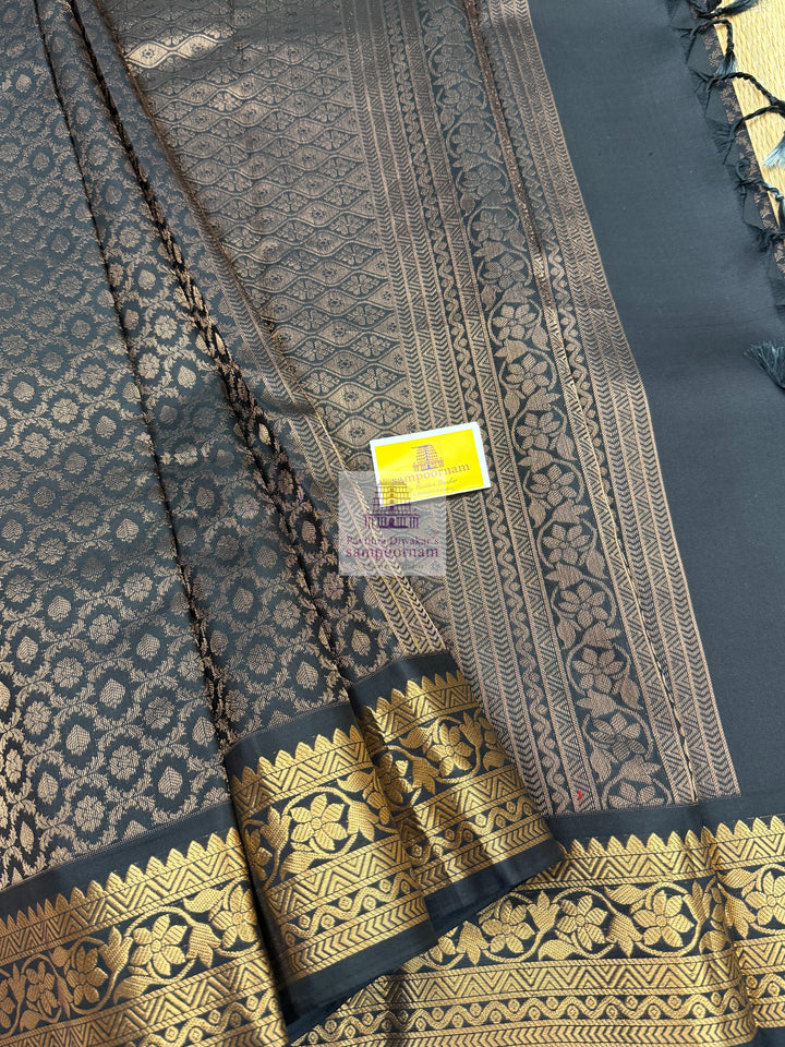 Black with Sage Green , Vairaoosi lines in the border , Floral Zari butta in the body and grand  Pallu Pure Soft Silk Saree