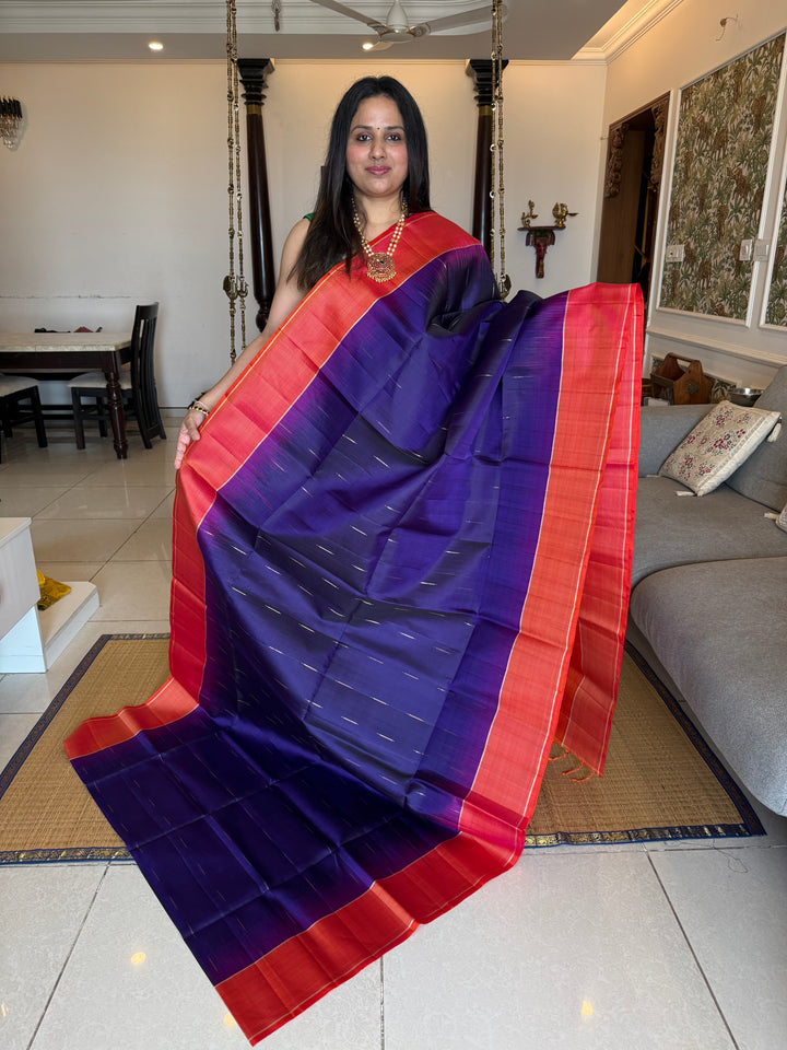 Indigo Blue with Orangish Pink raindrop zari motif in the body , vairaoosi borders and rich Pallu , pure soft silk saree
