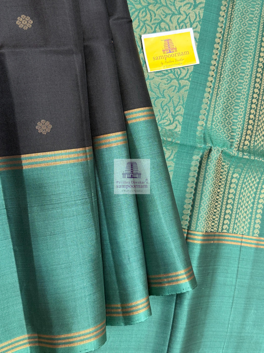 Black with Sage Green , Vairaoosi lines in the border , Floral Zari butta in the body and grand  Pallu Pure Soft Silk Saree