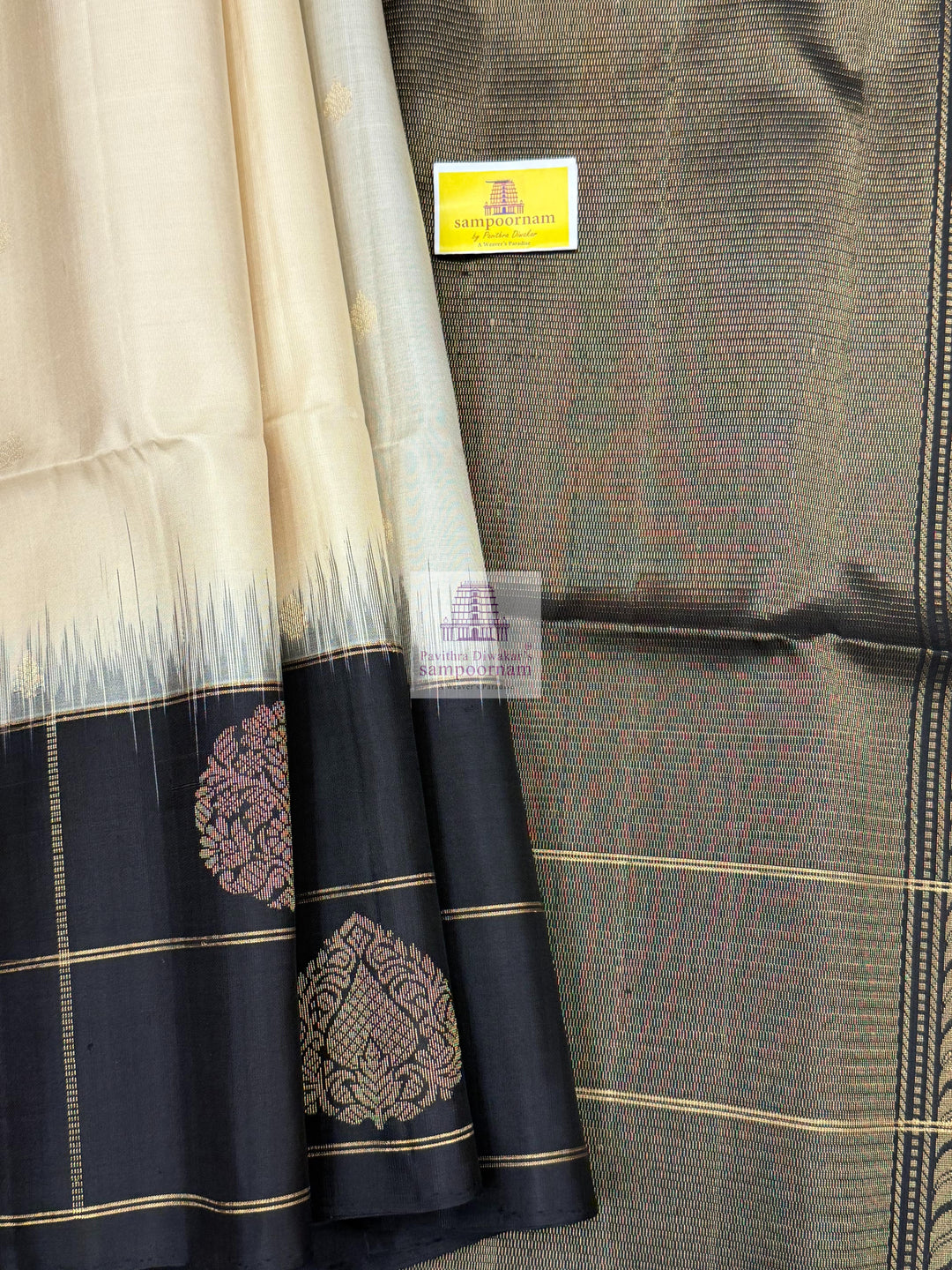 Offwhite with Black , one side big border , Vairaoosi lines and rich Zari butta in the body and grand  Pallu Pure Soft Silk Saree