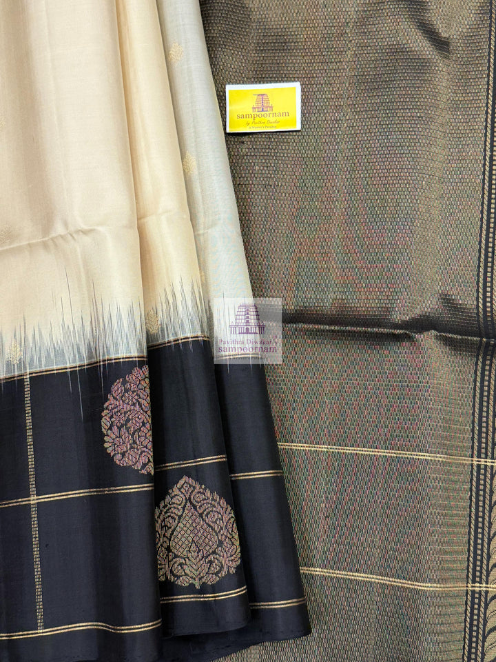 Offwhite with Black , one side big border , Vairaoosi lines and rich Zari butta in the body and grand  Pallu Pure Soft Silk Saree