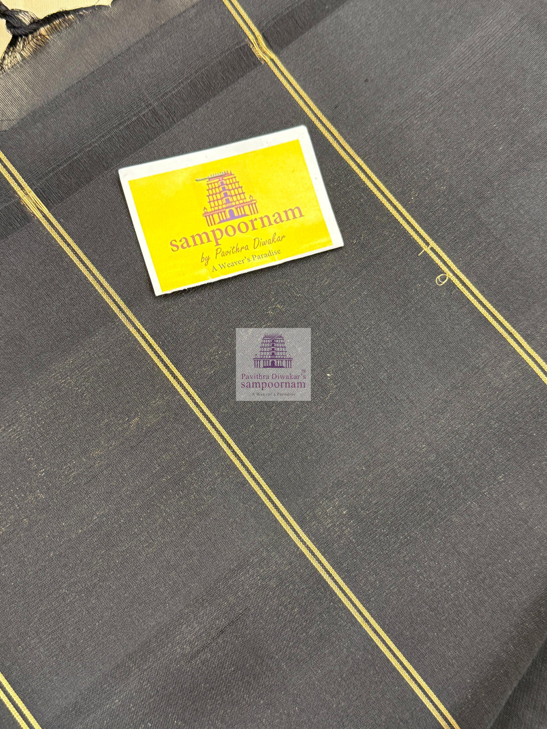 Offwhite with Black , one side big border , Vairaoosi lines and rich Zari butta in the body and grand  Pallu Pure Soft Silk Saree