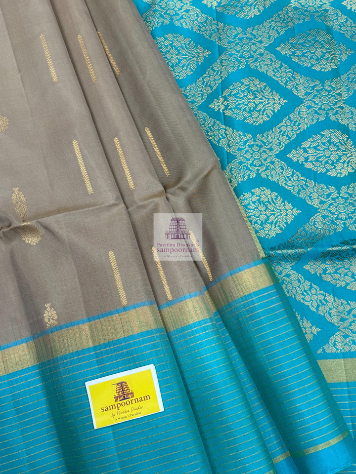 Dark Beige with Turquoise Blue , Zari lines in the border and Zari butta in the body  and rich Pallu Pure Soft Silk Saree