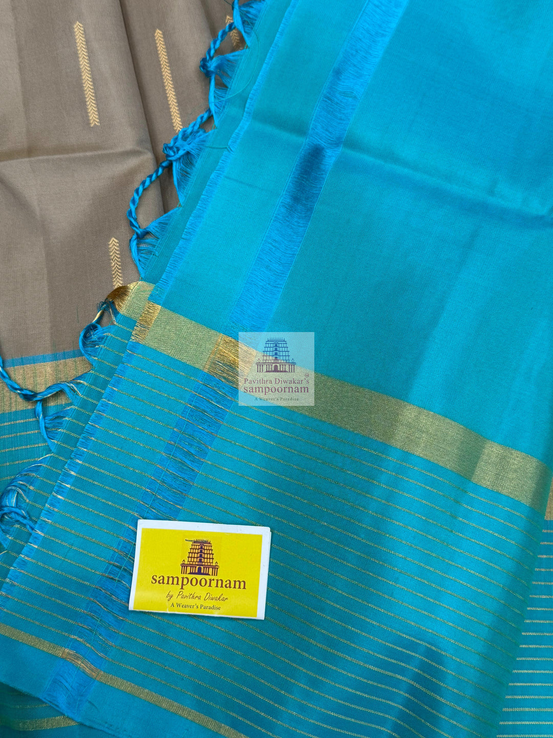 Dark Beige with Turquoise Blue , Zari lines in the border and Zari butta in the body  and rich Pallu Pure Soft Silk Saree