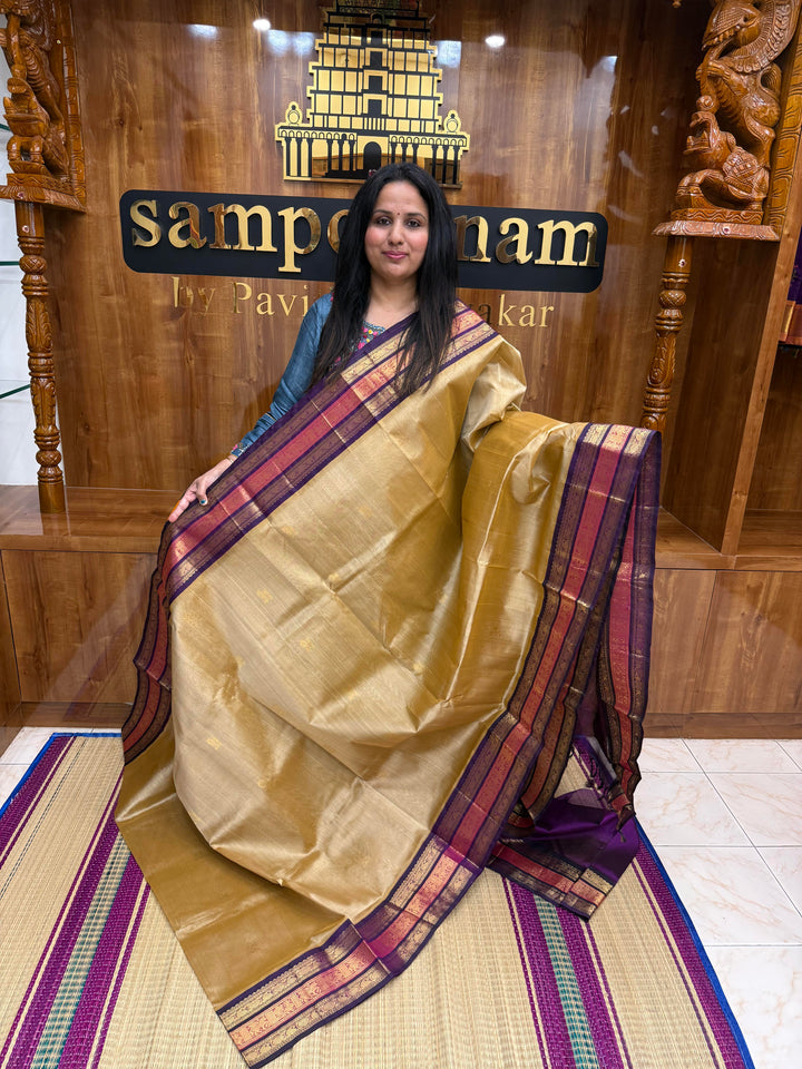 Light Gold with Purple , Rich Mango Zari butta in the body and Traditional Kanchi borders & rich Pallu Korvai Silk Cotton Saree