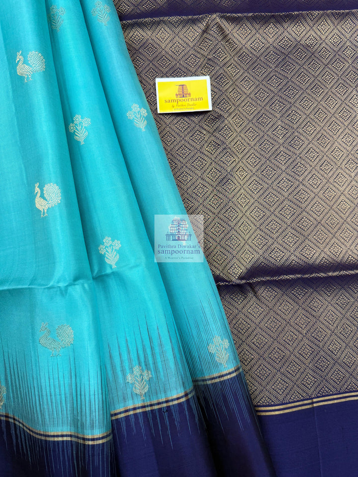 Blue with Dark Blue ,  Vairaoosi lines in the border , Annam and Floral butta in the body and rich Pallu Pure Soft Silk Saree