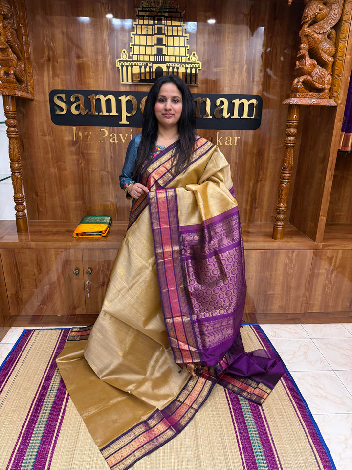 Light Gold with Purple , Rich Mango Zari butta in the body and Traditional Kanchi borders & rich Pallu Korvai Silk Cotton Saree