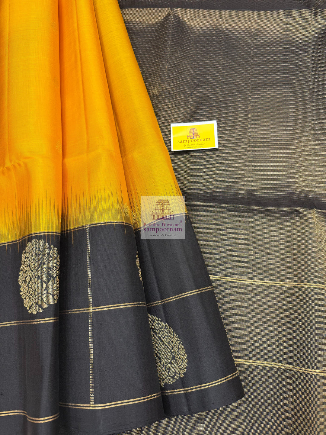 Mambazha Manjal with Black , one side big border , rich Zari butta in the body and grand  Pallu Pure Soft Silk Saree