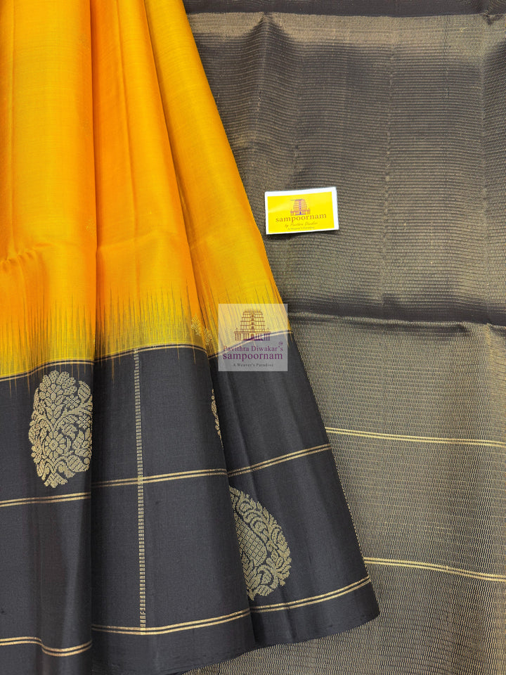 Mambazha Manjal with Black , one side big border , rich Zari butta in the body and grand  Pallu Pure Soft Silk Saree