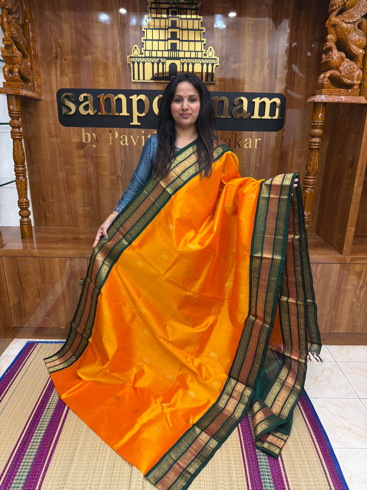 Mambazha Manjal with Green, Rich Mango Zari butta in the body and Traditional Kanchi borders & rich Pallu, Korvai Silk Cotton Saree