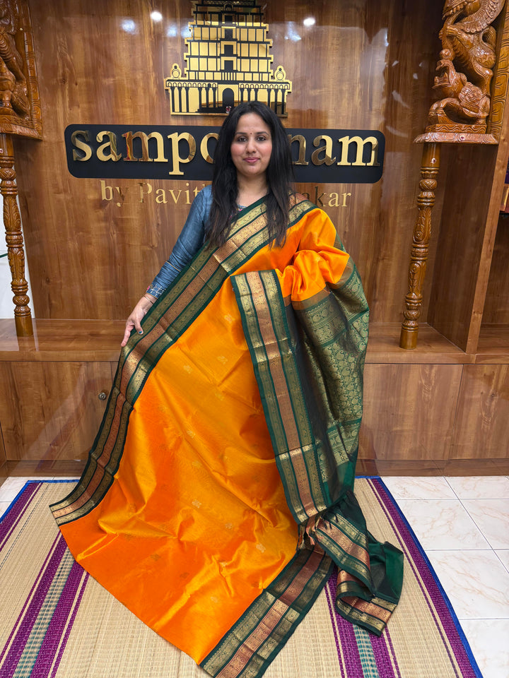 Mambazha Manjal with Green, Rich Mango Zari butta in the body and Traditional Kanchi borders & rich Pallu, Korvai Silk Cotton Saree