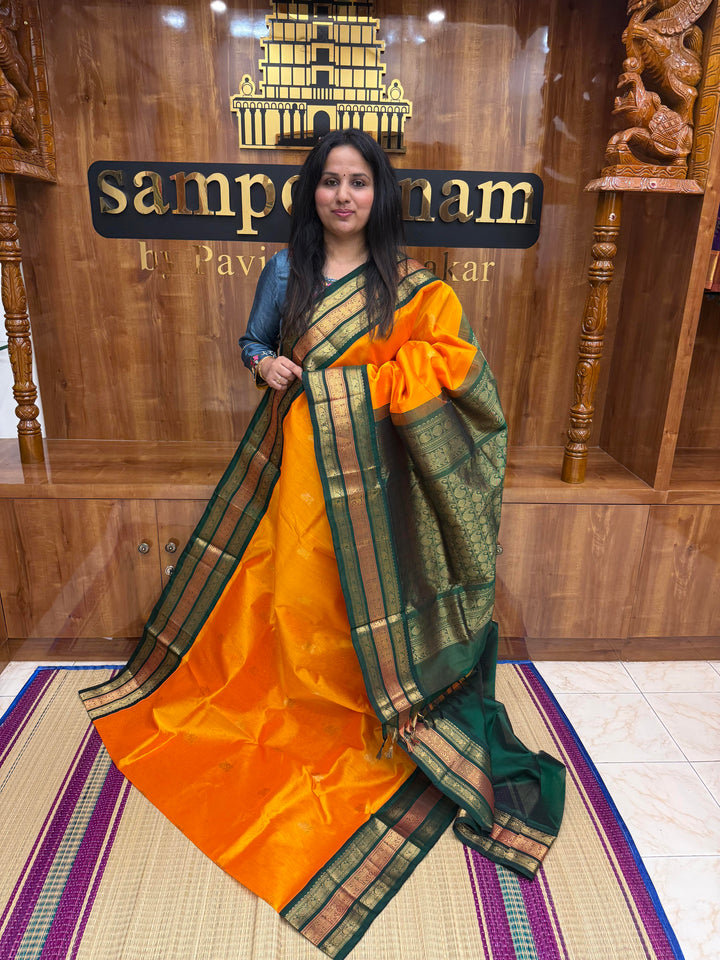 Mambazha Manjal with Green, Rich Mango Zari butta in the body and Traditional Kanchi borders & rich Pallu, Korvai Silk Cotton Saree